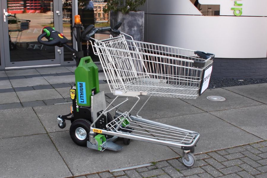 elektricky-tahac-movexx-tt1000-t-cp-manipulace-nakupnich-kosiku-supermarkety ručně vedený elektrický tahač movexx tt1000-t-cp, manipulace nákupních košíků pro supermarkety